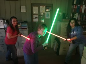 Administrative Support Professionals and Jedi Knights Angie, Dee, and Jeanette ready to face off against the dark side. Whoa Angie...watch where you're swinging that light saber!