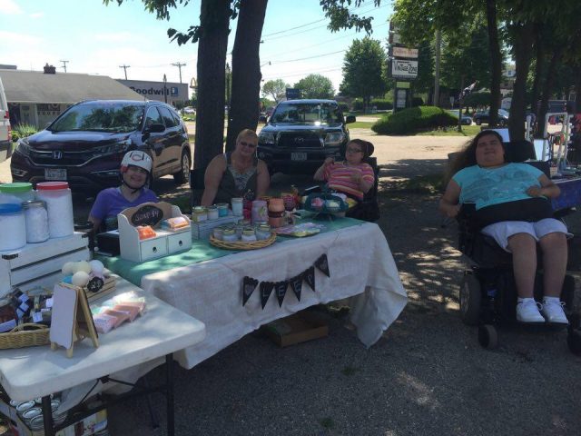 Dawn, Ingrid, Erin, and Sara selling LEEP made soaps, jellies and other handmade products.